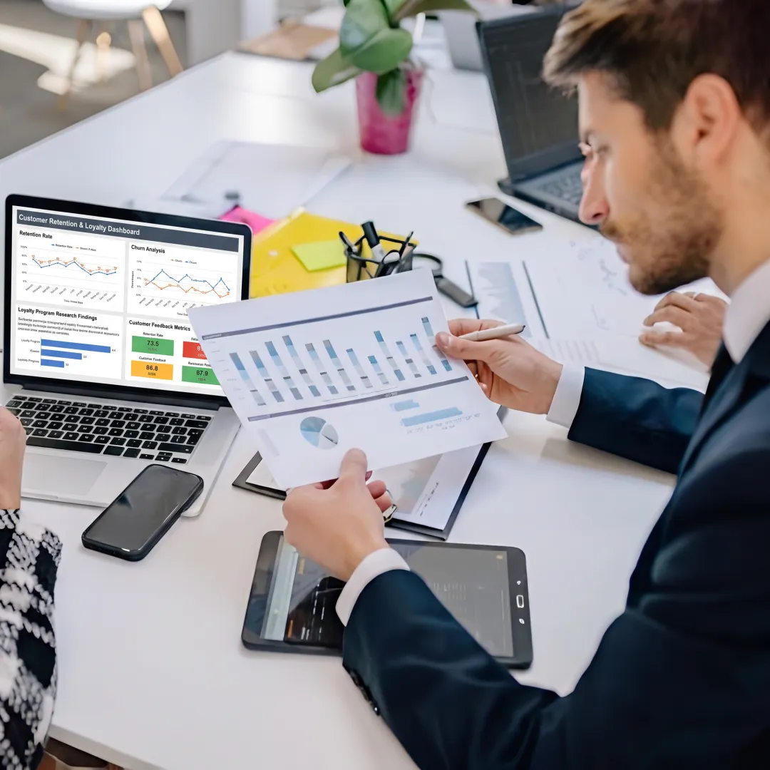 Consultants reviewing B2B customer loyalty insights